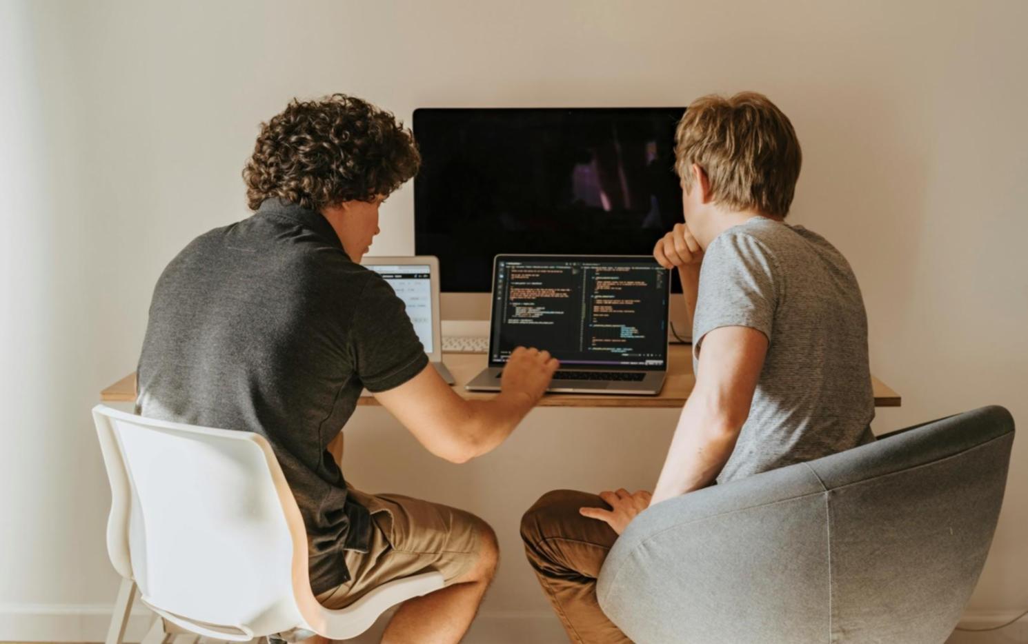 Development team analyzing code challenges and common programming issues